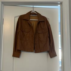 Faux Leather Lightweight Button Up Jacket. Never Worn. Brown Leather Button-up Blazer, Leather Outerwear With Buttoned Pockets For Winter, Long Sleeve Faux Leather Blazer With Button Closure, Chic Fall Leather Jacket With Flap Pockets, Chic Leather Jacket With Flap Pockets For Fall, Fall Blazer With Snap Buttons And Collar, Fall Collared Blazer With Snap Buttons, Chic Collared Outerwear With Faux Pockets, Fall Blazer With Collared Shape And Snap Buttons