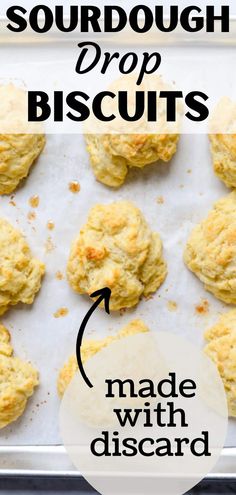 homemade sourdough drop biscuits on a baking sheet with the words made with disard