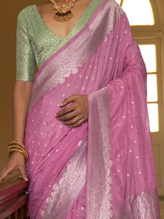 Celebrate your upcoming festivals, events, and any occasion with this beautifully designed astonishing pink weaving silk function wear saree with a blouse. This saree is perfect for adding an ethnic touch to your wardrobe and making you stand out in the crowd. The combination of the pink silk saree with weaving work and the pista green color silk blouse with weaving work creates a stunning and elegant look.
You can wear it to festivals, weddings, parties, or any special occasion and make a style Pista Green Saree Combination Blouse, Pink Slub Silk Pre-draped Saree With Dupatta, Pink Banarasi Silk Pre-draped Saree, Elegant Pink Blouse Piece With Zari Weaving, Designer Pink Art Silk Blouse Piece, Designer Art Silk Blouse Piece In Pink, Designer Pink Banarasi Silk Blouse, Designer Banarasi Silk Blouse In Pink, Festive Pink Chanderi Blouse Piece