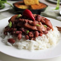 a white plate topped with rice and beans