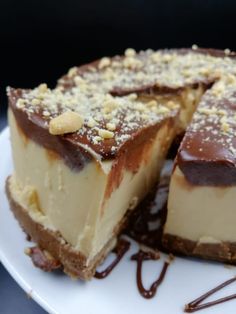 there is a piece of cheesecake with chocolate and nuts on the top, ready to be eaten