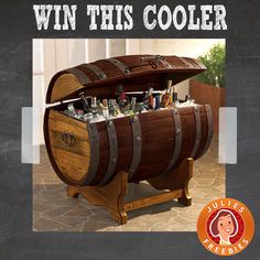 a wooden barrel with bottles in it and the words win this cooler