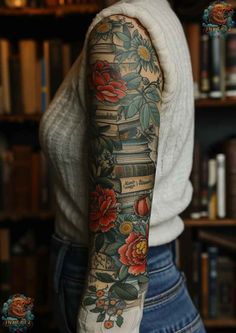 a woman's arm with books and flowers tattooed on the back of her arm