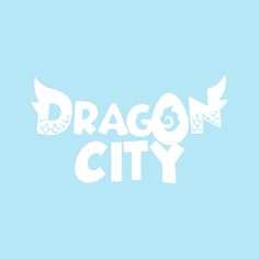 the dragon city logo is shown on a light blue background with white letters and wings