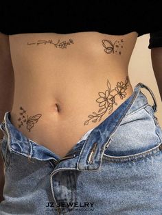 a woman's stomach with tattoos on it