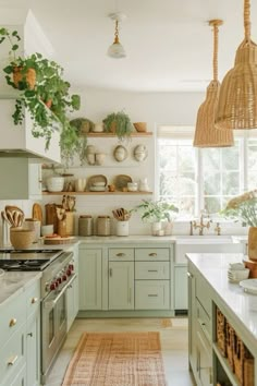 a kitchen filled with lots of green cabinets