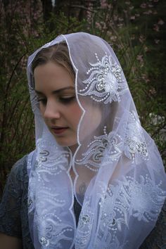 READY TO SHIP! PLEASE NOTE! Ships in 1-2 days. ONLY veils that state READY TO SHIP will ship in 1-2 days. Please order our custom veils on a separate order, or the entire order will ship within 2-3 weeks. A unique, handmade veil in an elegant, couture quality embroidered champagne mesh lace, with soft metallic gold accents/tiny sequins. Or white with silver accents. Please choose color at checkout. Includes a sewn-in clip. Measures about 46 X 21 inches. Evintage veils are handmade in limited pro Traditional White Veil, Christian Viel, Orthodox Veil Head Coverings, Spanish Lace Veil, Veiled Vestal Virgin, Elegant White Embroidered Veil, Lace Headwrap, Religious Veils, Elegant Veils