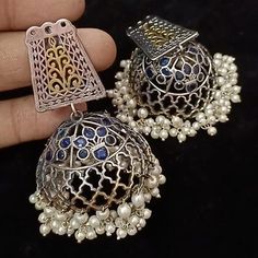 German Silver Oxidized TwoTone Big Jhumka/Afghani Silver Jhumka/Dual Tone/Blue/Green Oxidized Jhumka/Dual Tone Jhumka Earring @JhumkaStop - Contemporary earrings with simulated stones in silver golden dual tone finish. - Very Elegant and stylish, these earrings can be paired with any traditional Indian or Western Attire depending upon the occasion and the theme. - The base is pure brass (90%) and pure 92.5 silver (10%) which makes this very sturdy and of good quality. - 100% guarantee on the pol Dual-tone Chandbalis For Diwali Festivities, Festive Dual-tone Chandbalis For Diwali, Fusion Style Dual-tone Danglers For Festive Occasions, Navratri Festive Dual-tone Danglers, Dual-tone Danglers For Navratri Festival, Dual-tone Danglers For Navratri, Multicolor Chandbali Jhumkas With Intricate Design, Blue Jhumkas With Latkans For Celebration, Fusion Style Jhumkas With Latkans For Celebration