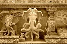 an intricately carved sculpture depicting elephants and other animals