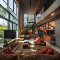 a living room filled with furniture and lots of windows