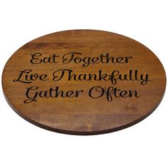 a wooden sign that says eat together, love thanksgiving and gather often