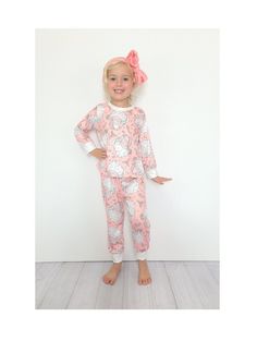 "Girls Retro Santa Print Christmas Pajama *Bring in the season with this adorable boutique PJ set! *Butter cotton (cotton blend) is soft and washes well. *Manufactured by a production partner of Hissy Fitz Boutique 12/18 mo top: 14\" long & 9.5\" wide pants: 19\" long & 8.5 wide hips 2t top: 15\" long & 10.5\" wide pants: 20\" long & 9 wide hips 3t top: 16\" long & 11.5\" wide pants: 21\" long & 9.5 wide hips 4t top: 17\" long & 12.5\" wide pants: 22\" long & 10\" wide hips 5/6 top:18\" long & 1 Pink Cotton Christmas Sleepwear, Pink Cotton Sleepwear For Holiday, Cute Pink Sleepwear For Holiday, Cute Cotton Holiday Sleepwear, Playful Cotton Sleepwear For Holidays, Playful Cotton Holiday Sleepwear, Playful Holiday Cotton Sleepwear, Playful Pink Sets For Holiday, Playful Pink Holiday Sets