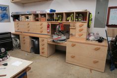 a workbench with many drawers and tools