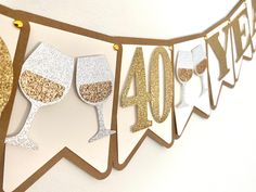 a banner with wine glasses hanging from it's sides and the number forty four