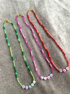 Design your perfect necklace ✨ These beaded necklaces are fully customized. I can make it in two colors like in the picture, one, or rainbow, you pick!  If you want two of more colors please let us know in the personalization box!  Let me know which name, word or initials you want to put on it as well as the Letters color🤍 in the personalization box  Letters can be: Black, Purple, Pink, Green, Orange, Yellow or Blue Fun Letter Beads For Jewelry Making, Trendy Personalized Beaded Necklaces For Gifts, Pink Letter Beads Fun Necklaces, Cute Letter Beads Necklaces For Friendship, Cute Beaded Necklace With Letter Beads For Gift, Cute Beaded Necklaces With Letter Beads For Gift, Cute Letter Beads Beaded Necklace As Gift, Fun Pink Beaded Necklaces With Letter Beads, Cute Beaded Necklaces With Tiny Beads For Gifts