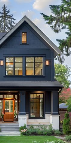 a large blue house with lots of windows