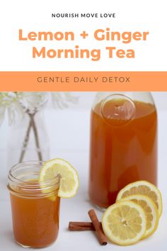 lemon ginger morning tea with cinnamon sticks and an orange slice next to it on a white table