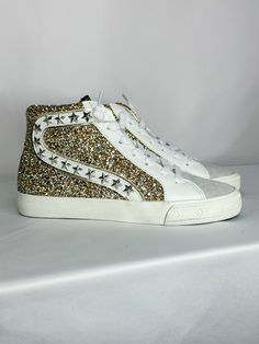 These Vintage Havana high tops are GOLDEN!! The sparkles, the laces, the details are everything you could want in a sneaker! Features silver stars studded on the side and a zipper! Kick off your day the right way with these sparkle beauties!! Vintage Havana Shoes, Havana Shoes, High Top Sneaker, Vintage Havana, Top Vintage, Star Studs, Silver Stars, Havana, High Top