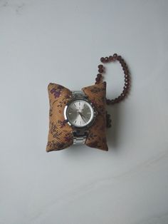 "Watch Pillow, Jewelry Pillow, Watch Box Pillow, Bracelet, Watch Display, Watch Storage, Watch Holder, Accessories, Custom Watch Pillow These completely handmade pillows are made to order in a part of my house that I have turned into a workshop. These pillows, where you will display your watches in a stylish way, are sewn securely using quality fabrics that you can use for many years. This product is made of polyester fabric. The product in the image;  3,5'' x 4''  inches  --- (8,9 cm. x 10,1cm.) Pillows are filled with poly-fil filling. I'm overfilling it so that it gets enough fullness that you'll need. This will give you the ability to remove some as needed. It will be easier for you to remove the poly-fil filler after purchasing it than to add it. **Size**  3'' x 3'' inches ---- (7,6 c Silver Rectangular Watch Accessories For Gifts, Silver Rectangular Watch Accessories As Gift, Rectangular Silver Watch Accessories For Gifts, Silver Watch Accessories As A Gift, Luxury Vintage Watch Accessories With Date Display, Silver Watch Accessories With Round Dial For Gift, Gift Watch With Bracelet Strap And Round Dial, Silver Analog Watch Accessories As Gift, Gift Watches With Bracelet Strap And Round Dial