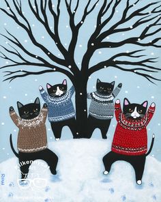 three black cats wearing sweaters standing in front of a tree with snow falling on it