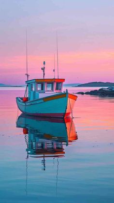 a small boat floating on top of a body of water at sunset in the ocean