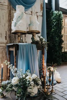 a table with candles and flowers on it