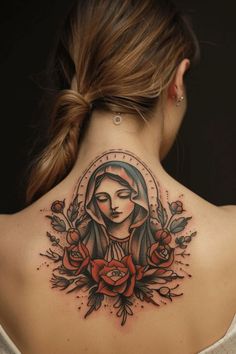 the back of a woman's neck with roses on it and a virgin mary tattoo