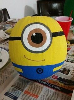 a yellow and blue ball sitting on top of a table