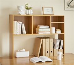 a book shelf with books and papers on it