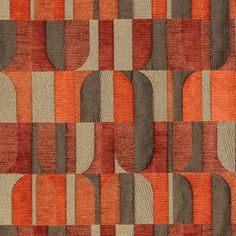 an orange and brown rug with circles on it