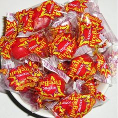 a white plate filled with red and yellow candies