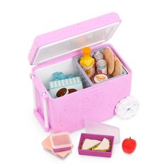 a pink lunch box filled with lots of food