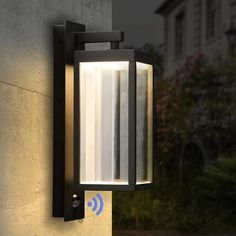 a wall mounted light on the side of a building