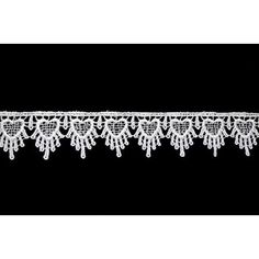 a white lace trim with hearts and flowers on the edge is shown against a black background