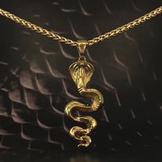 This is a Cobra necklace, a handmade jewelry. This unisex necklace is the perfect gift for him and her any time of the year  Immerse yourself in the mystical world and discover your inner power with our handmade cobra pendant necklace. Inspired by the sacred serpent, this handmade pendant invites you to explore spirituality and awaken your inner strength. The cobra symbolizes transformation, rebirth, and ancient wisdom. Its presence evokes the energy of kundalini, a powerful life force that lies Spiritual Gold Plated Necklace As A Gift, Handmade Snake-shaped Necklace For Gift, Handmade Snake Shape Necklace Gift, Handmade Snake Shape Necklace For Gift, Handmade Snake Necklace For Gifts, Unique Box Chain Necklaces As Gift, Unique Box Chain Necklace For Gift, Spiritual Brass Jewelry In Snake Shape, Spiritual Brass Snake-shaped Jewelry