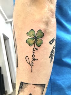 a man with a shamrock tattoo on his arm