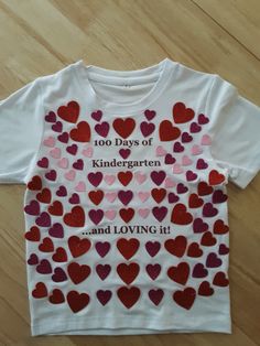 a t - shirt with hearts on it that says 100 days of kindergartn and loving it