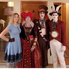 three people dressed in costumes posing for a photo