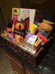 a basket filled with food and snacks on top of a counter