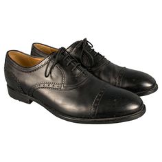 GUCCI shoes in a black leather fabric featuring an oxford style with cap toe, and lace-up closure. Made in Italy.Very Good Pre-Owned Condition. Minor signs of wear. Marked: 312279 9Outsole: 11.5 inches x 4 inches Sui Generis Reference: 129293 Category: Lace Up Shoes More Details Brand: GUCCI Size: 9.5 Gender: Male Color: Black Pattern: Perforated Fabric: Leather Style: Cap Toe Age Group: Adult Classic Oxford Lace-up Shoes With Rubber Heel Cap, Classic Lace-up Leather Shoes With Rubber Heel Cap, Classic Fitted Lace-up Oxfords, Oxford Cap Toe Lace-up Shoes With Rubber Heel, Cap Toe Oxford Lace-up Shoes With Rubber Heel, Black Cap Toe Oxfords With Leather Sole, Classic Black Oxfords With Laces, Classic Black Leather Cap Toe Shoes, Classic Black Cap Toe Leather Shoes