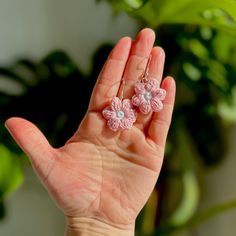 Charming Pink Daisy Micro Crochet Dangle Earrings--A delicate floral touch to elevate your style. Handcrafted with precision using quality cotton thread, these earrings are not only lightweight but also hypoallergenic, ensuring comfort for sensitive ears. The intricate micro crochet technique showcases a soft, delicate pink design, adding a touch of nature-inspired elegance to any outfit. Treat yourself or a loved one to these unique, artisanal earrings that effortlessly blend beauty and craftmanship.   These flowers are approximately 2.5cm in size. They have been crocheted by me with a 1.5mm hook and cotton thread, then finished with hypoallergenic silver-plated copper sterling ear wires. Handmade Pink Everyday Jewelry, Handmade Pink Jewelry For Everyday Wear, Elegant Crochet Dangle Earrings, Delicate Handmade Everyday Earrings, Adjustable Pink Crochet Jewelry, Handmade Adjustable Flower Earrings For Wedding, Pink Crochet Jewelry Gift, Handmade Delicate Flower Hoop Earrings, Handmade Delicate Adjustable Hoop Earrings