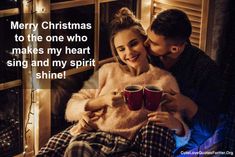 a man and woman holding coffee mugs in front of a window with the caption merry christmas to the one who makes my heart sing and my spirit shine