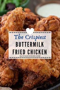 the crispiest buttermilk fried chicken on a plate with ranch dressing