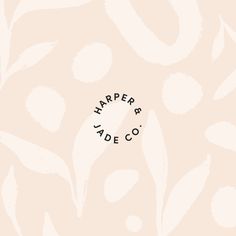 the logo for harper & jade co on a pink background with white and black leaves