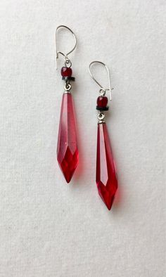 These classic long red faceted vintage Czech glass earrings are embellished with vintage crystal clear and black Czech glass accents. They have an overall drop of 2 inches and dangle from sterling silver earwires. Thank you for visiting Lucy Isaacs Jewelry here at our online boutique To view all of my vintage Czech glass items, copy and paste the link below https://www.lucyisaacsjewelry.com Poison Mushroom, Mushroom Cookie, Hammered Silver Jewelry, Fantasy Earrings, Silver Jewelry Diy, Goth Clothing, Red Accessories, Gem Earrings, Red Jewelry