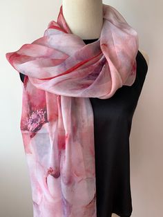 Large long natural mulberry silk chiffon scarf with dimension of 180cm x 110 cm/ 71in x 43in. A watercolor styled print, with a soft blend of pinks and reds. The gorgeous flowers and the flowy petals bring a delightful feel of gentleness, and the dark red border ties the print together. Light weight, soft and sheer fabric, airy, breathable, and skin-friendly feels very comfortable to wear.  It's a beautiful addition to your outfit and can style it in different ways: drape it over shoulder and tie it as a shawl, wear the scarf as a soft neck scarf, as an evening cover up, as a head scarf, as an outdoor cover up or style it any way you want with your own sense of creativity... Suitable for all seasons and is a wonderful  gift idea for special occasions. Care Instructions: Pure silk is a type Silk Neck Scarf, Silk Chiffon Scarves, Chiffon Shawl, Chiffon Wrap, Red Border, Gorgeous Flowers, Outdoor Cover, Wedding Shawl, Large Scarf