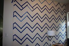 the wall is painted with blue and white chevrons on it's side