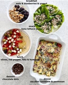 four bowls filled with different types of food on top of a white counter next to each other