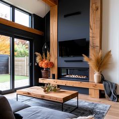 a living room with a couch, coffee table and large sliding glass doors that open to the backyard