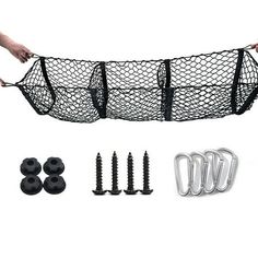 a black net with screws and nails in it next to some other items on a white background